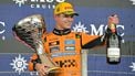 McLaren's British driver Lando Norris celebrates with the trophy and champagne after winning the Sao Paulo Formula One Grand Prix at the Jose Carlos Pace racetrack, aka Interlagos, in Sao Paulo, Brazil on November 9, 2025. 
Nelson ALMEIDA / AFP