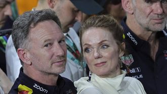 Red Bull Racing team principal Christian Horner (L) along with his wife British singer Geri Halliwell attends the podium ceremony of the podium ceremony of the Saudi Arabian Formula One Grand Prix at the Jeddah Corniche Circuit in Jeddah on March 9, 2024. 
Giuseppe CACACE / AFP