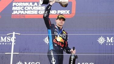 epa11263569 First place Red Bull Racing driver Max Verstappen of the Netherlands celebrates with his trophy on the podium after the Formula One Japanese Grand Prix at the Suzuka International Racing Course in Suzuka, Japan, 07 April 2024.  EPA/FRANCK ROBICHON