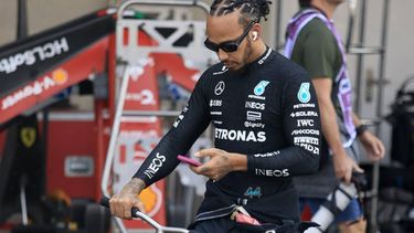 Mercedes' British driver Lewis Hamilton checks his mobile phone before the start of the Mexico City Grand Prix at the Hermanos Rodriguez racetrack, in Mexico City on October 27, 2024.  
CARLOS PEREZ GALLARDO / POOL / AFP