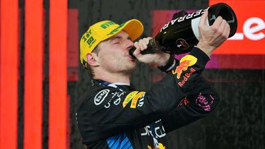 Red Bull Racing's Dutch driver Max Verstappen drinks from the winners bottle at the podium of the Formula One Sao Paulo Grand Prix, at the Jose Carlos Pace racetrack, aka Interlagos, in Sao Paulo, Brazil, on November 3, 2024. 
NELSON ALMEIDA / AFP