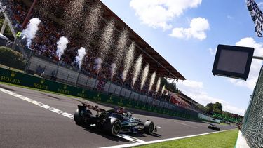 Mercedes' British driver Lewis Hamilton (L) crosses the finish line after Mercedes' British driver George Russell (R) drives during the Formula One Belgian Grand Prix at the Spa-Francorchamps Circuit in Spa on July 28, 2024. 
SIMON WOHLFAHRT / POOL / AFP