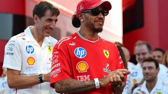 epa13216472 Scuderia Ferrari driver Lewis Hamilton (C) of Britain prepares at the paddock prior to the Formula One Italian Grand Prix in Monza, Italy, 06 September 2026.  EPA/ANNA SZILAGYI