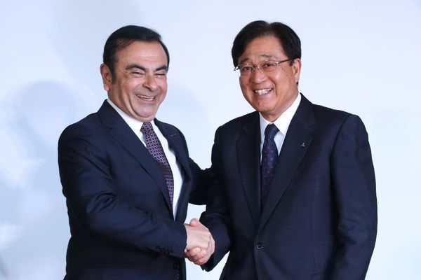 Nissan Motor CEO Carlos Ghosn And Mitsubishi Motors Chairman And CEO Osamu Masuko Attend News Conference