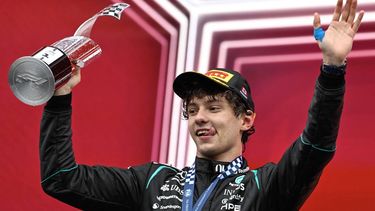 Mercedes' Italian driver Kimi Antonelli raises the trophy on the podium while celebrating his first place finish at the 2026 Formula 1 Grand Prix du Canada at Circuit Gilles-Villeneuve in Montreal, Canada, on May 24, 2026.  
Andrej Ivanov / AFP