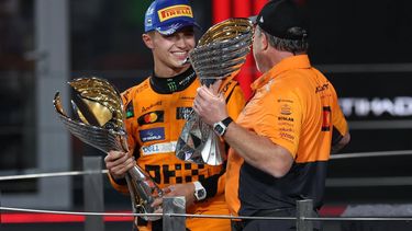 epa11764934 McLaren Racing CEO Zak Brown and his driver Lando Norris of Britain celebrate on the podium after the Formula One Abu Dhabi Grand Prix, at the Yas Marina Circuit racetrack in Abu Dhabi, United Arab Emirates, 08 December 2024.  EPA/ALI HAIDER