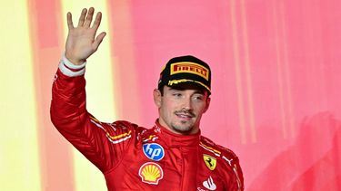 Second-placed Ferrari's Monegasque driver Charles Leclerc waves from the podium at the end of the Qatari Formula One Grand Prix at the Lusail International Circuit in Lusail, north of Doha, on December 1, 2024. 
Giuseppe CACACE / AFP