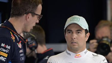 Red Bull Racing's Mexican driver Sergio Perez (R) speaks with a team engineer during the third practice session of the Formula One Mexico City Grand Prix at the Hermanos Rodriguez racetrack, in Mexico City on October 26, 2024. 
Alfredo ESTRELLA / AFP