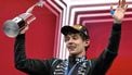 Mercedes' Italian driver Kimi Antonelli raises the trophy on the podium while celebrating his first place finish at the 2026 Formula 1 Grand Prix du Canada at Circuit Gilles-Villeneuve in Montreal, Canada, on May 24, 2026.  
Andrej Ivanov / AFP