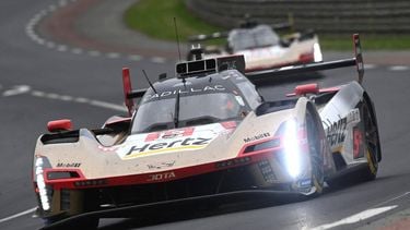 Cadillac Hertz Team Jota's British driver #12 Will Stevens (front) steers his hypercar in front of Cadillac Hertz Team Jota's New Zealand driver #38 Earl Bamber during the 2025 Le Mans 24 hour endurance race, at the Le Mans circuit, in north-western France on June 14, 2025. 
JEAN-FRANCOIS MONIER / AFP