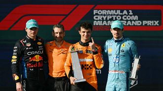 (L-R) Second place, Red Bull Racing's Dutch driver Max Verstappen; McLaren's Italian team principal Andrea Stella; first place, McLaren's British driver Lando Norris; and third place, Ferrari's Monegasque driver Charles Leclerc, stand on the podium after the 2024 Miami Formula One Grand Prix at Miami International Autodrome in Miami Gardens, Florida, on May 5, 2024.  
Jim WATSON / AFP