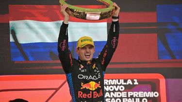Red Bull Racing's Dutch driver Max Verstappen celebrates at the podium with the trophy of the Formula One Sao Paulo Grand Prix, at the Jose Carlos Pace racetrack, aka Interlagos, in Sao Paulo, Brazil, on November 3, 2024. 
NELSON ALMEIDA / AFP