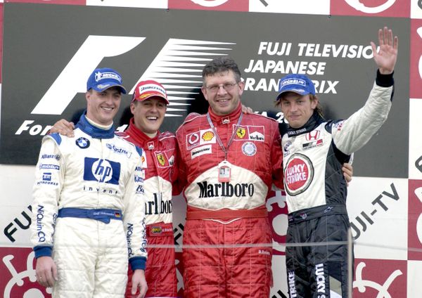 Ralf Schumacher, Michael Schumacher, Ross Brawn en Jenson Button.