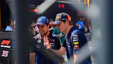 Red Bull's Mexican driver Sergio Perez and Red Bull's Dutch driver Max Verstappen chat with fans at the paddock of the Circuit de Catalunya on June 22, 2024 in Montmelo, on the outskirts of Barcelona, during the Spanish Formula One Grand Prix. 
MANAURE QUINTERO / AFP