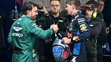 Aston Martin's Spanish driver Fernando Alonso (L) congratulates Red Bull Racing's Dutch driver Max Verstappen after he won his fourth consecutive Formula One world title after the Las Vegas Formula One Grand Prix in Las Vegas, Nevada on November 23, 2024.  
Frederic J. Brown / AFP
