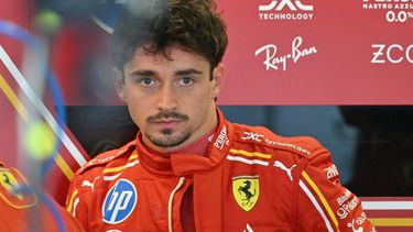 Ferrari's Monegasque driver Charles Leclerc reacts as he stands in the pits ahead of the first practice session ahead of the Abu Dhabi Formula One Grand Prix at the Yas Marina Circuit in Abud Dhabi on December 6, 2024. 
Andrej ISAKOVIC / AFP