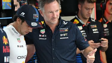 Red Bull Racing's British team principal and CEO Christian Horner gives a thumb up next to Red Bull Racing's Mexican driver Sergio Perez (L) before third practice session, ahead of the Italian Formula One Grand Prix at Autodromo Nazionale Monza circuit, in Monza on August 31, 2024. 
Gabriel BOUYS / AFP