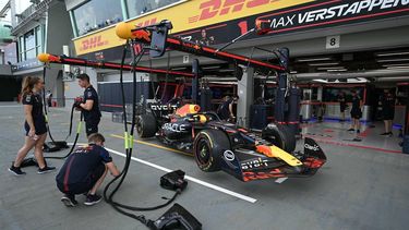 2023-09-15 02:00:00 Mechanics work on the car of Red Bull Racing's Dutch driver Max Verstappen before the first practice session for the Singapore Formula One Grand Prix night race at the Marina Bay Street Circuit in Singapore on September 15, 2023. 
MOHD RASFAN / AFP