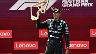 Winner Mercedes' British driver George Russell celebrates on the podium with the trophy after the Formula One Austrian Grand Prix at the Red Bull Ring race track in Spielberg, Austria on June 28, 2026. 
Joe Klamar / AFP
