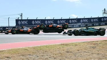 McLaren's Australian driver Oscar Piastri (C) goes airborne alongside McLaren's British driver Lando Norris (L) and Aston Martin's Spanish driver Fernando Alonso (R) during the United States Formula One Sprint at the Circuit of the Americas in Austin, Texas, on October 18, 2025. 
Jim WATSON / AFP