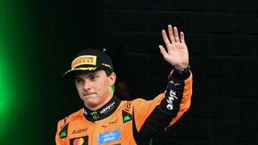 Winner McLaren's Australian driver Oscar Piastri celebrates as he arrives on the podium following the Formula One Dutch Grand Prix at The Circuit Zandvoort, western Netherlands, on August 31, 2025. 
NICOLAS TUCAT / AFP