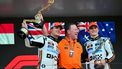 McLaren's British driver Lando Norris (L) lifts his trophy in the air as he celebrates winning the Formula One Monaco Grand Prix on the podium with McLaren's CEO Zak Brown (C) and third-placed McLaren's Australian driver Oscar Piastri (R) at the Circuit de Monaco, on May 25, 2025. 
Andrej ISAKOVIC / AFP