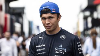epa12275115 Williams driver Alex Albon of Thailand walks in the paddock at the Hungaroring racetrack in Mogyorod near Budapest, Hungary, 31 July 2025. The 2025 Formula 1 Hungarian Grand Prix is held at the Hungaroring racetrack on 03 August.  EPA/Boglarka Bodnar HUNGARY OUT