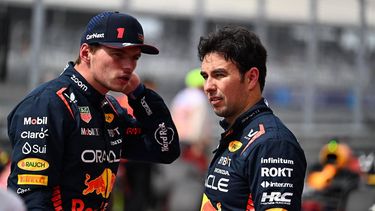 2023-10-21 20:19:52 Red Bull Racing's Dutch driver Max Verstappen and Red Bull Racing's Mexican driver Sergio Perez stand in the pit after the Sprint Shootout at the Circuit of the Americas in Austin, Texas, on October 21, 2023, ahead of the United States Formula One Grand Prix. 
Chandan Khanna / AFP