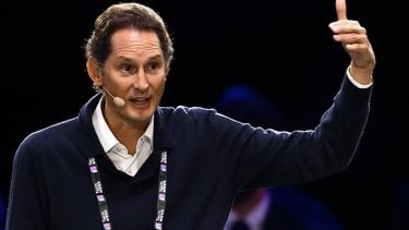 Stellantis' Chairman John Elkann (R) gestures as he speaks with Amazon's founder Jeff Bezos (unseen) on stage during the Italian Tech Week 2025, at OGR Officine Grandi Riparazioni, in Turin, northern Italy, on October 3, 2025.  The Italian Tech Week, one of the most important tech conferences in Europe, brings together more than 15,000 people every year to discuss the latest developments in AI, space, climate, mobility, and health.
MARCO BERTORELLO / AFP