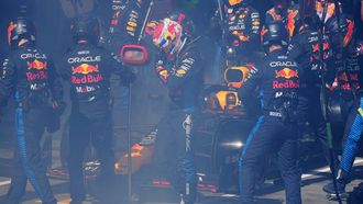 Red Bull Racing's Dutch driver Max Verstappen (C) walks back to the garage after smoke billowing from his car during the Australian Formula One Grand Prix at Albert Park Circuit in Melbourne on March 24, 2024.  
Scott Barbour / POOL / AFP