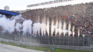 Pyrotechnics go off as Red Bull Racing's Dutch driver Max Verstappen crosses the finish line to win the Dutch Formula One Grand Prix race at The Circuit Zandvoort, in Zandvoort on August 27, 2023. 
John THYS / AFP