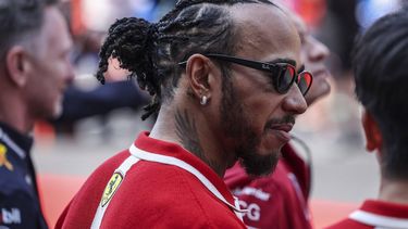 epa11982367 Scuderia Ferrari driver Lewis Hamilton (C) of Britain looks on during the driver parade before the 2025 Formula 1 Chinese Grand Prix at the Shanghai International Circuit in Shanghai, China, 23 March 2025.  EPA/WU HAO