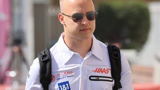 Haas' Russian driver Nikita Mazepin arrives at the track ahead of the practice session of the Abu Dhabi Formula One Grand Prix at the Yas Marina Circuit in the Emirati city of Abu Dhabi on December 9, 2021. 
Giuseppe CACACE / AFP