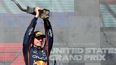 Red Bull Racing's Dutch driver Max Verstappen hoists the trophy on the podium after winning the United States Formula One Grand Prix at the Circuit of the Americas in Austin, Texas, on October 19, 2025. 
Jim WATSON / AFP